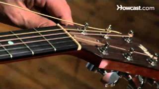 How to Restring a Steel String Guitar  Guitar Lessons [upl. by Bedwell280]