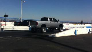 2006 Dodge RAM Cummins Show Truck with SSR and 8quot lift vs Duramax at sac raceway [upl. by Atronna]