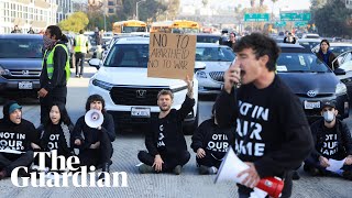 Dozens of activists block Los Angeles highway calling for Gaza ceasefire [upl. by Yelsek]