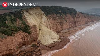 Cottage left teetering on the brink of 400ft drop after Jurassic Coast cliff fall [upl. by Anelrad]