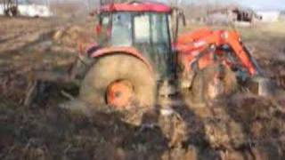 Kubota M9000 4X4 Tractor stuck in the mud [upl. by Eatnhoj407]