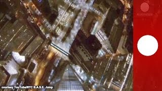 Night base jump in NYC Skydivers plunge from One World Trade Center [upl. by Aylmer581]