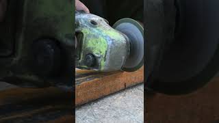 Mans hands cutting a metal pipe in two pieces with an angle grinder [upl. by Justin372]