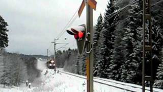 NetRail freight train pulled by Ma 825 Electric locomotive passing a level crossing at Bystad [upl. by Aileek440]