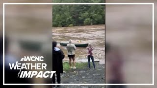 Caught on cam Man risks life to save woman from raging floodwaters [upl. by Gylys]