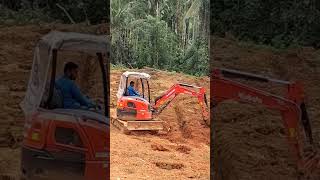 Manuering the earthmovers kubota minihitachi excavator [upl. by Neelahtak]