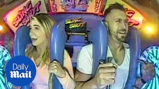 Hilarious moment couple go on fun fair ride the slingshot  Daily Mail [upl. by Rafaellle]