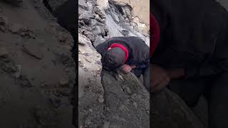 Palestinian man searches through rubble for family [upl. by Antsirhc]