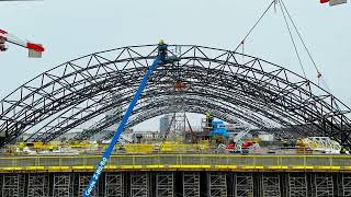 Installation process of the Rail Baltica Riga Central Station roof’s fourth arch [upl. by Adnwahsar]