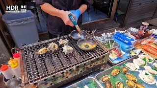 Grilled Japanese Tsubugai amp Abalone at Kuromon Market [upl. by Ardnalak]