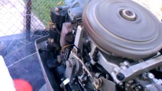 making adjustments to idle speed on a 70hp Evinrud [upl. by Atnes]