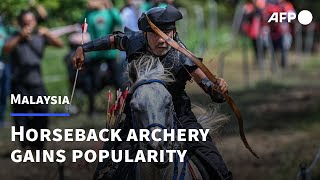 Horseback archery Malaysians take a shot at ancient pastime  AFP [upl. by Nomaid703]