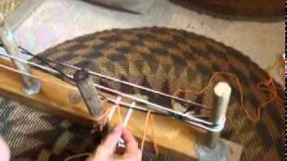 Adding string heddles as you wind a warp for backstrap weaving [upl. by Aihsot]