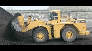 Caterpillar 990 Wheel Loader Loading Trucks With Two Passes [upl. by Aysab359]