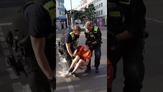 Car drives through eco protesters and police remove activists by the neck [upl. by Aney]