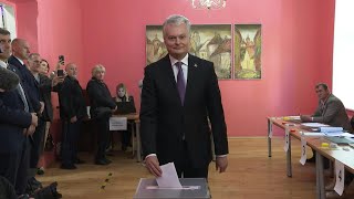 Lithuanian President Nauseda casts vote in presidential election  AFP [upl. by Fermin]