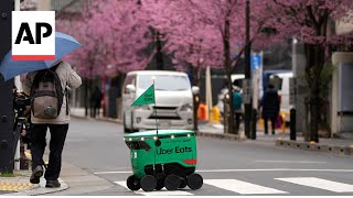 Uber Eats launches robot food delivery service in Tokyo [upl. by Aicinod]