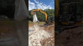 excavatorfunny bentonite bag ripping on the pond install equipmentfail [upl. by Garate]