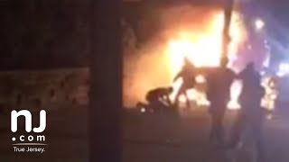 Video shows police kicking victim of fiery crash Warning video contains graphic content [upl. by Gerrard]