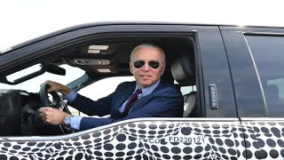 President Joe Biden drives Fords new electric pickup truck at the Michigan plant [upl. by Ecirtnahc]