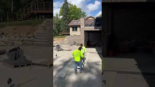 Using a paver vacuum to lay pavers construction patio [upl. by Elbys]