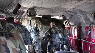 Nebraska National Guard Soldiers drop bales of hay for cattle stranded by flooding [upl. by Gnov]