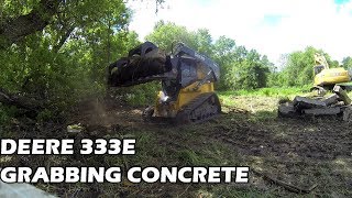 Deere 333E Track Skid Steer Quick Attach grapple removing concrete foundation [upl. by Nnylav627]