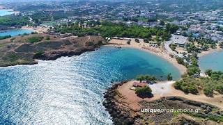 Agioi Apostoloi Beach in Chania Crete  4K Aerial Video by Unique Productions [upl. by Nemrak]