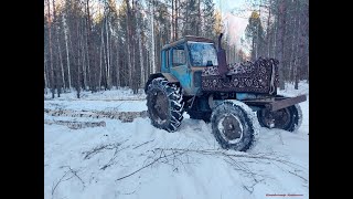 На МТЗ80 в лес по льду и грязи на цепях MTZ80 tractor on ice and mud [upl. by Mart906]