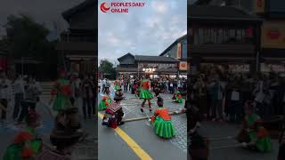 Journalists from Asia Pacific countries perform a bamboo dance in SW Chinas Guizhou [upl. by Sandler]