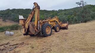 Massey Ferguson MF40 destroys old fallen tree [upl. by Loredo214]