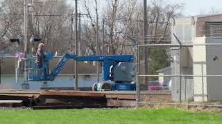 Articulating Boom lift crossing the tracks in Deshler Ohio [upl. by Elbys]