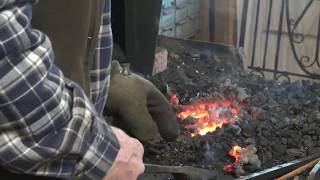 Starting and maintaining a coal forge fire  basic blacksmithing [upl. by Anilok]