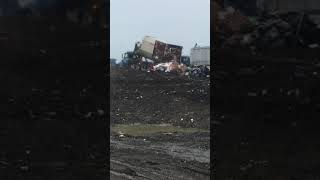 Dumping a roll off compactor at the landfill [upl. by Tarazi539]