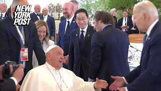 Biden embraces surprisedlooking Pope Francis with foreheadtoforehead hug at G7 summit [upl. by Xavler947]