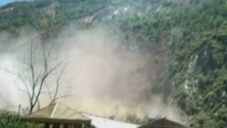 Dramatic footage Huge landslide ravages China village [upl. by Oirevas13]