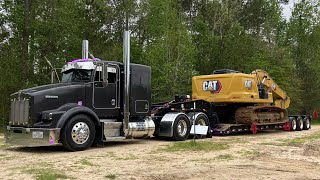 hauling oversize CAT excavator RGN lowboy trucker [upl. by Clarkson]