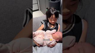 My 4 year old daughter carries a newborn for the first time 👶🍼 [upl. by Ruthy]