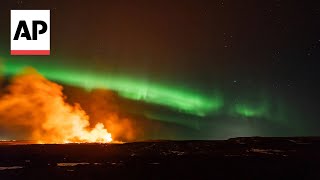 Iceland volcano erupts amidst Northern Lights display  AP EXCLUSIVE [upl. by Silsbye548]