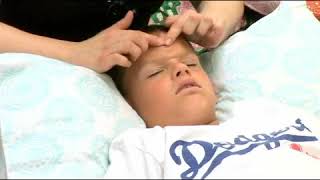 Massaging Nose of Child to Treat Sinus Congestion [upl. by Elletnahc]