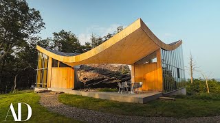 Inside a Family Home Built Around a 12000YearOld Boulder  Unique Spaces  Architectural Digest [upl. by Neetsyrk]