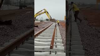 Excavator installing metal beam of railroad [upl. by Aikahc645]