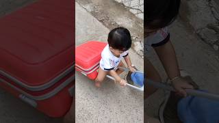 Little baby sitting on trolley bag funny baby video shorts viral video [upl. by Peyton482]