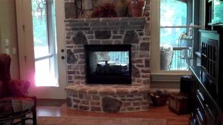 Sitting room with built in bookcases two sided fireplace and special trey ceiling [upl. by Arrehs110]