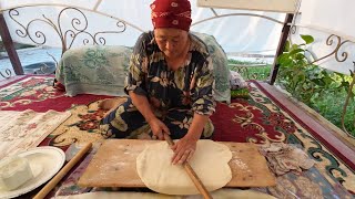 Kyrgyz lady making Borsok fried puffed bread the traditional way [upl. by Ramsay776]