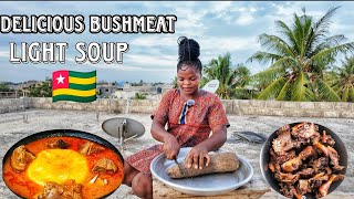 African village cooking Delicious bushmeat light soup and yam fufu [upl. by Aihsekyw]