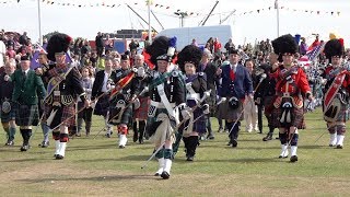 Massed Pipes amp Drums parade through town to start the 2018 Nairn Royal Brackla Highland Games [upl. by Enala]