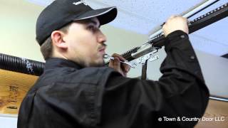 How to Adjust the Chain Tension of Garage Door Opener  Town amp Country Door LLC [upl. by Lellih]