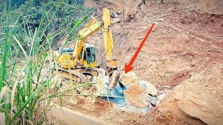 Severe rockfall  Komatsu pc 200 excavator clears rock and soil  Construction machine [upl. by Eislek]