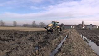 PLOUGHING in Paddy 2014  CHALLENGER MT765B  EMMEGIEMME 5Furrow [upl. by Cul845]